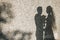 Silhouettes of honeymooners on a wall