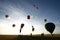 Silhouettes of hot air balloons in the sky