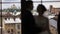 Silhouettes just married couple near big window