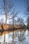 Silhouettes landscape view sunset Water reflection, a canal in a large nature reserve, Fochteloerveen, The Netherlands