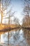 Silhouettes landscape view sunset Water reflection, a canal in a large nature reserve, Fochteloerveen, The Netherlands