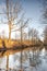 Silhouettes landscape view sunset Water reflection, a canal in a large nature reserve, Fochteloerveen, The Netherlands