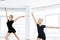 The silhouettes of little ballerina and personal ballet teacher dancing