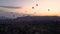 Silhouettes Lots of hot air balloons flying over valleys in Goreme, Turkey. Tourists from all over the world come to