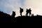 Silhouettes of men on the Etna