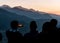 Silhouettes of men at sunset, Pokhara, Nepal.