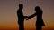 Silhouettes Of Men And Women Quarrel At Sunset Sky