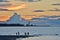 Silhouettes Metis Lighthouse and Everest of a cloud at sunset