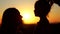 Silhouettes of mother and her daughter heads. Mom talking with her child.
