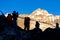 Silhouettes of Mountain Climbers against high Peaks