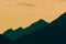 Silhouettes of mountains with an orange color of sunset and sunrise. Forest silhouettes