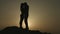 Silhouettes of newlyweds couple kissing passionately. Romantic love story