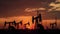 Silhouettes of oil derricks taking oil at dusk with the sunset in the background. AI generated