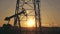 Silhouettes of oil wells pumping at sunset