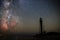 Silhouettes of the Old Lighthouse sandy beach and ocean against the background of the starry sky