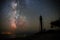 Silhouettes of the Old Lighthouse sandy beach and ocean against the background of the starry sky