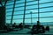 Silhouettes of people in the airport`s boarding lounge