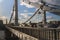 Silhouettes of people and cars on the steel bridge