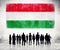 Silhouettes of People and a Flag of Hungary