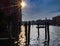 The silhouettes of people and gondolas port and old houses in Venice in Italy