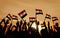 Silhouettes of People Holding the Flag of Egypt