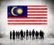 Silhouettes of People Looking at the Malaysian Flag