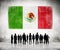 Silhouettes of People Looking at the Mexican Flag