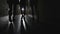 Silhouettes of people walking in the hallway