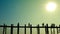 Silhouettes of people walking on the old teak bridge. Burma, Mandalay