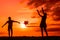 Silhouettes of playing boy with windmill and girl with ball in the nature