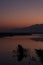 Silhouettes of Reeds and Hills Before Sunrise