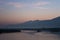 Silhouettes of Reeds and Hills Before Sunrise