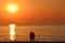 Silhouettes of romantic hugging couple on the beach