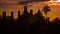 Silhouettes of the ruins of ancient temples at sunset. Thailand, Sukhothai