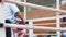 Silhouettes of Russian boxers in the ring during fight. Competitors fight in the boxing ring. Men dressed in protective