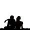 Silhouettes of sad couple sitting back to back