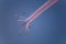 Silhouettes of the skydiver team flying in formation