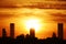 Silhouettes of skyscrapers of Istanbul against the sunset sky.