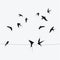 Silhouettes of swallows sitting on wires. Black contour of a flock of birds. Black and white illustration. Tattoo.