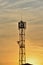 Silhouettes telecommunication tower in a woderful orange