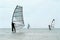 Silhouettes of a three windsurfers