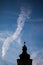 Silhouettes of towers and architectural parts with blue sky and white clouds