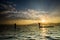 Silhouettes of the traditional fishermen throwing fishing net du