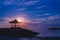 Silhouettes of a traditional gazebos against the dawn sky on Sanur beach