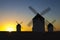 Silhouettes of traditional windmills at Campo de Criptana site,