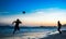 Silhouettes of two jumping men playing beach football at Copacabana, Rio de Janeiro