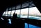 Silhouettes of two women in Muslim headscarves dresses look out of the window