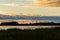 Silhouettes of wind power stations in a row at the east coast of