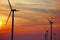 Silhouettes of Wind Turbines on an Wind Farm at Sunset