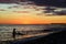 Silhouettes of woman and child on the seashore